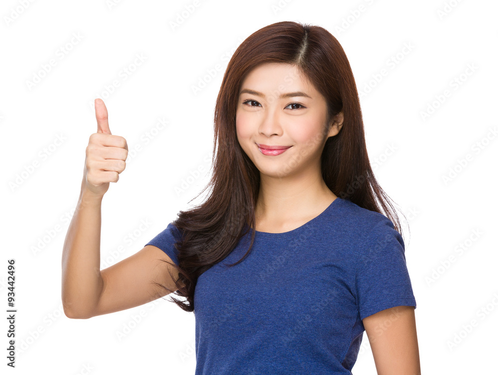 Asian Young woman showing thumb up gesture Asian Young woman showing thumb up gesture