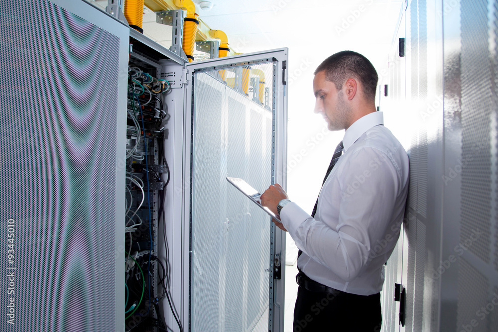 businessman using tablet server room