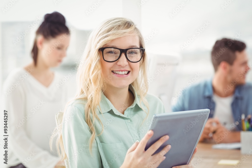 Portrait of happy woman wearing eyeglasses using digital tablet Portrait of happy woman wearing eyeglasses using digital tablet