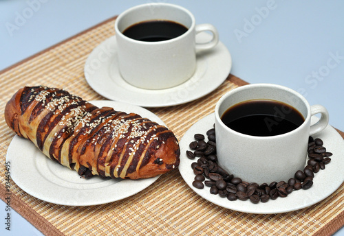 hot coffee with red bean bread on bamboo mat