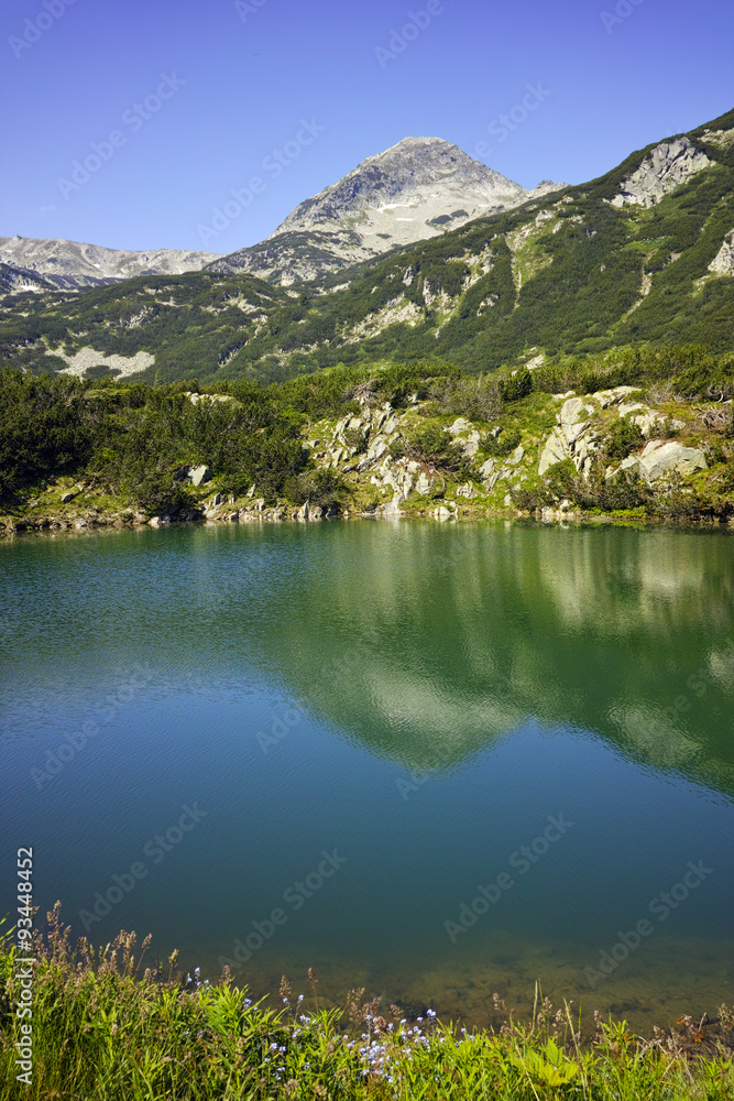 Reflection of Muratov peak in Okoto lake, Pirin Mountain, Bulgaria