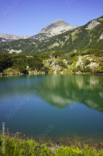 Reflection of Muratov peak in Okoto lake, Pirin Mountain, Bulgaria