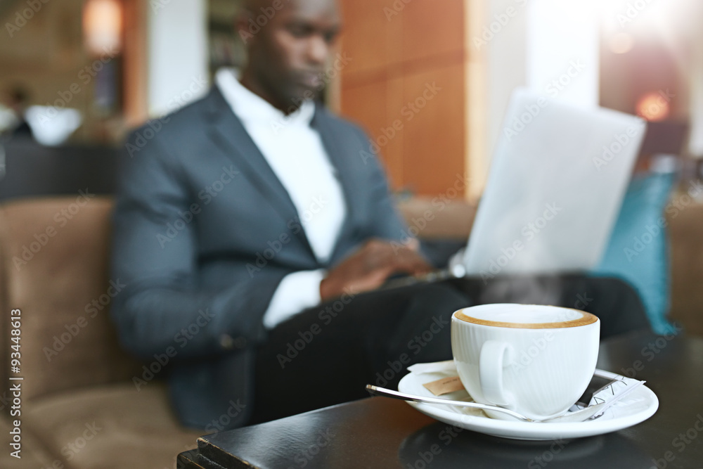 Refreshing hot cup of coffee on table at hotel lobby Refreshing hot cup of coffee on table at hotel lobby