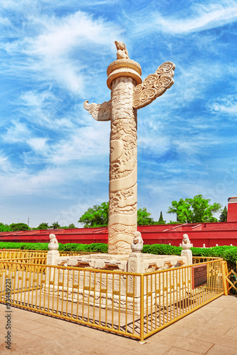 Monument-Stone column (huabiao) with depiction of dragons and ph photo