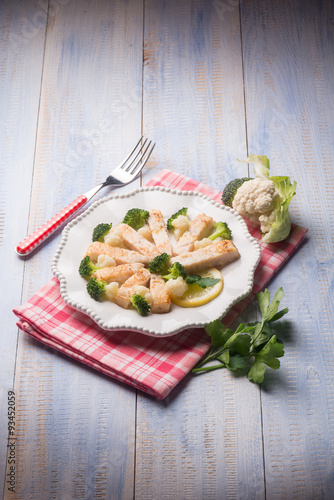 sliced swordfish with broccoli and cauliflower salad