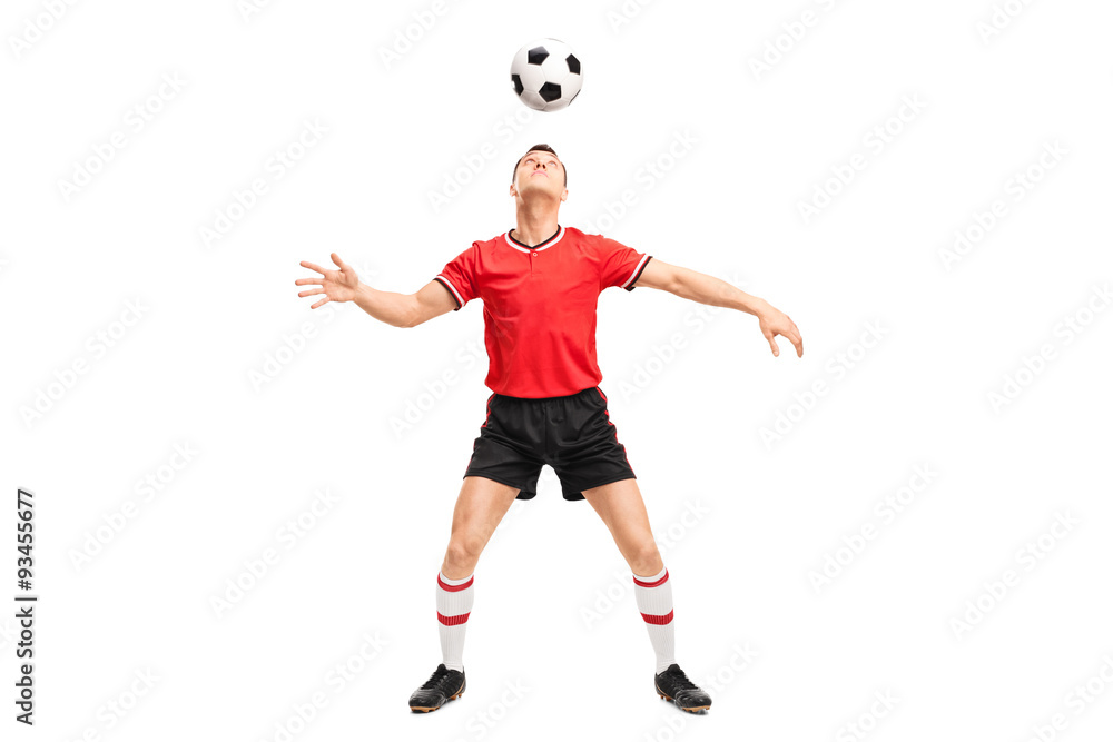 Football player juggling a ball on his head