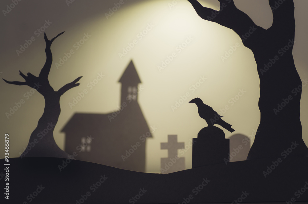 halloween scene with crow and trees in graveyard
