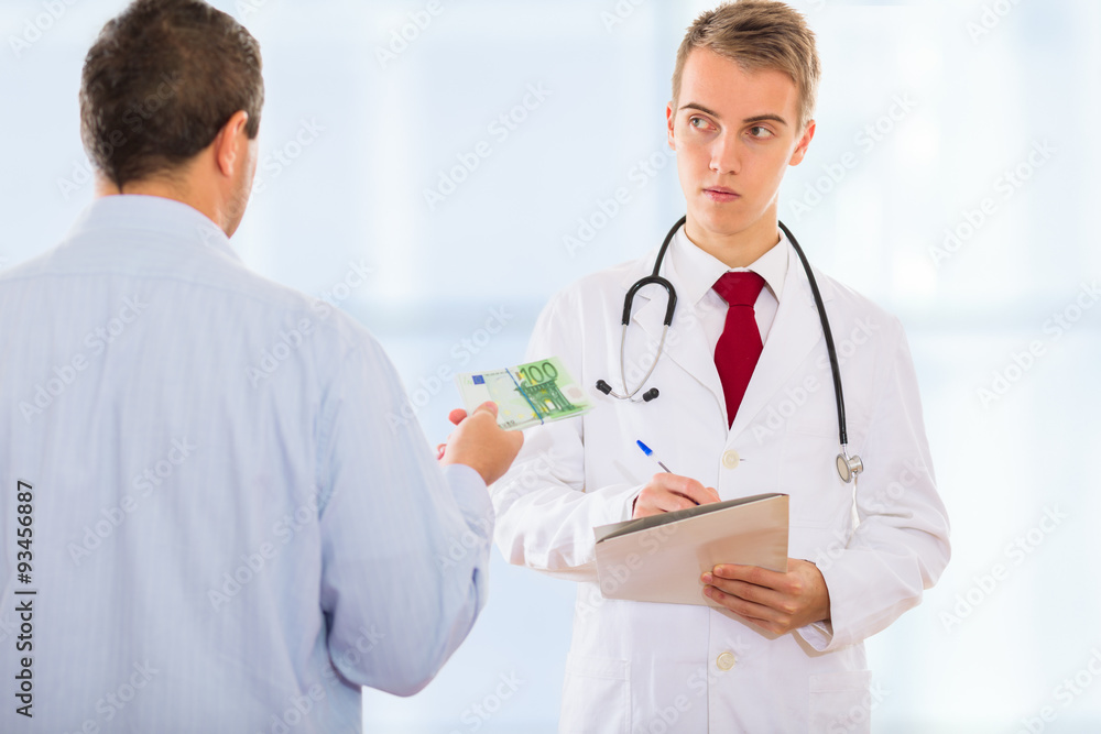 Man offering money to a doctor in order to bribe him to falsify some documents Man offering money to a doctor in order to bribe him to falsify some documents