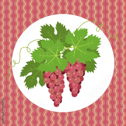 Pink grapes with leaves on pink background