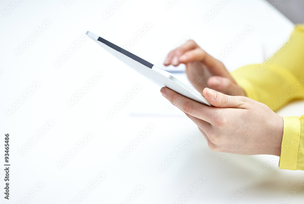 close up of female hands with tablet pc at table close up of female hands with tablet pc at table