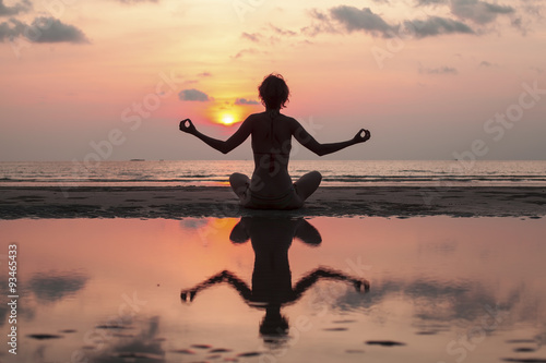 Beautiful yoga silhouette and meditation background. © De Visu
