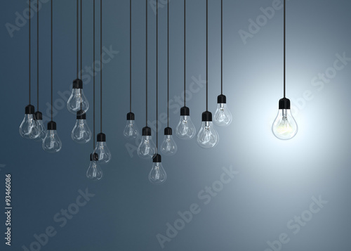 lightbulbs  and one lighting bulb on blue background, idea conce