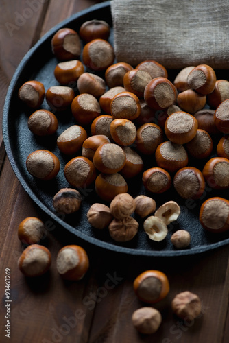 Close-up of a frying pan with hazelnuts, selective focus