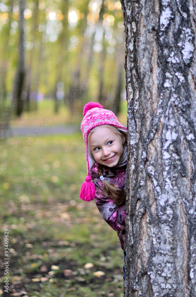 happy little child girl playing in the autumn park happy little child girl playing in the autumn park
