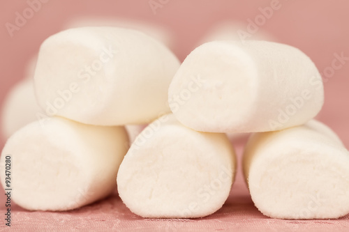 sweet marshmallows on a pink background