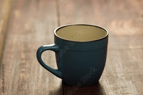 empty blue Cup on wooden background