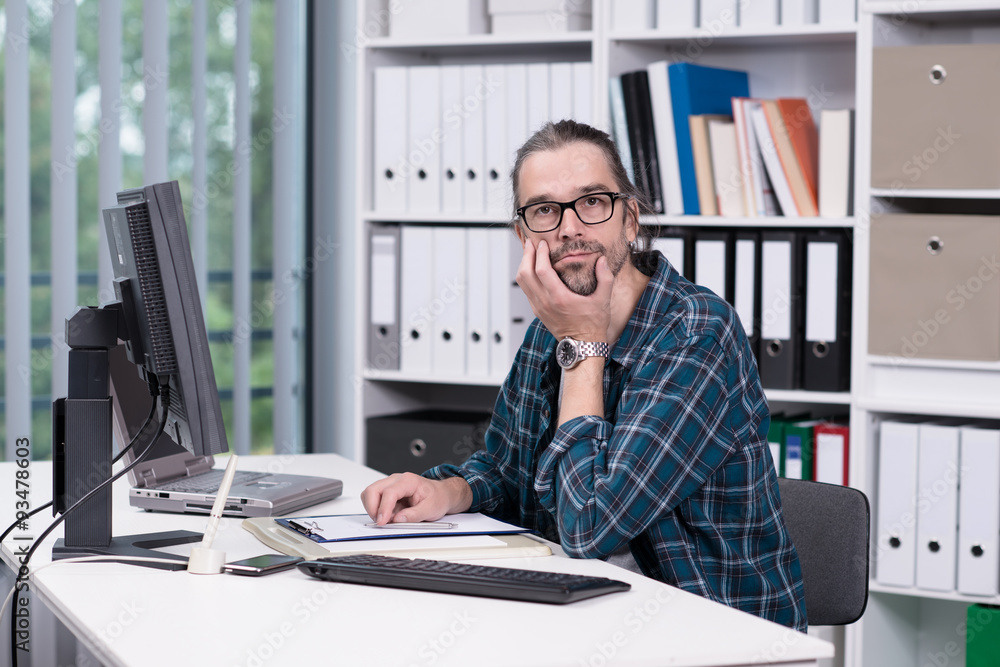 Fototapeta premium man is working in his office