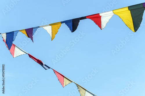 Flags used for medieval festivals. Blue sky on background.