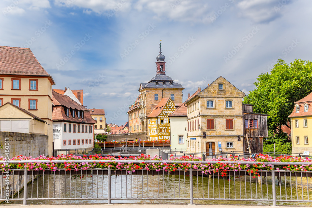 Bamberg. Picturesque views of the old town hall (1461), bridges decorated with flowers and old buildings on the islands in the Regnitz river