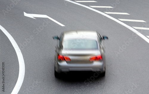 car on street with arrow direction