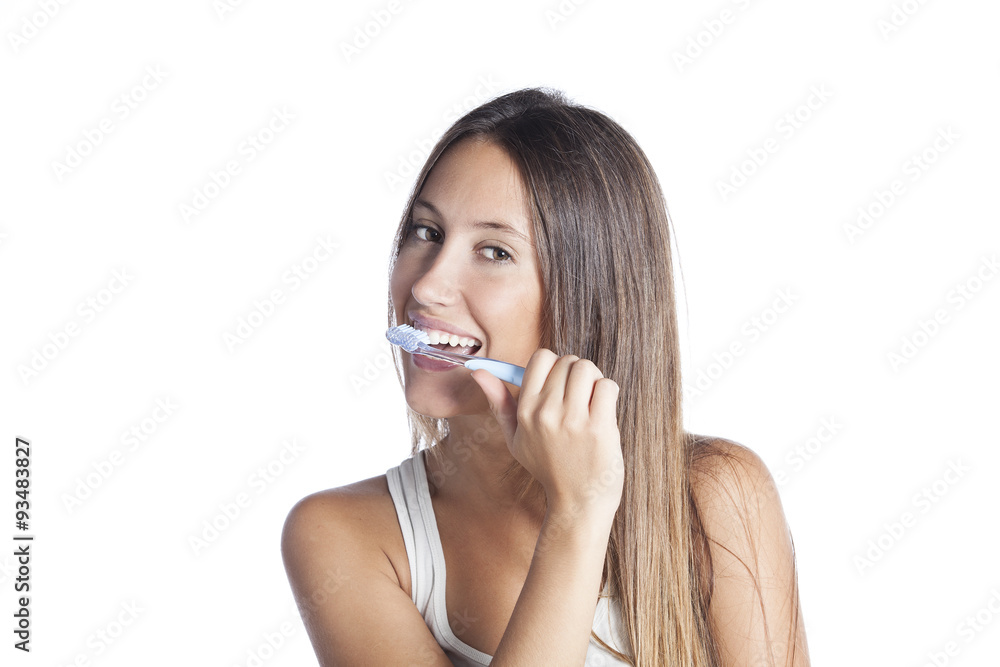 Beautiful smiling woman cleaning her teeth with a toothbrush in a dental hygiene concept. Isolated on white Beautiful smiling woman cleaning her teeth with a toothbrush in a dental hygiene concept. Isolated on white