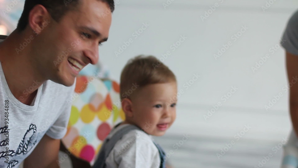 Happy family on photosession near wooden horse Happy family on photosession near wooden horse