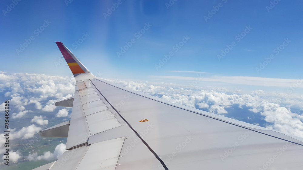 The sky outside the plane window glass