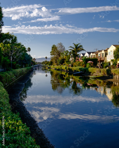 Clouds reflect in the canals at Venice, California