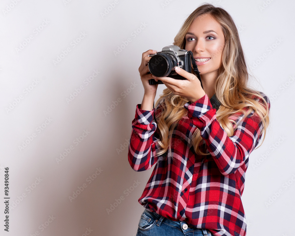 Woman-photographer takes images, isolated on white background Woman-photographer takes images, isolated on white background