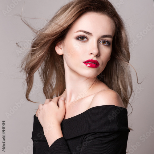 Portrait of beautiful blonde woman with curly hairstyle and bright makeup, perfect skin, skincare, spa, cosmetology. Sexy vogue woman face, sensual beauty girl model. Natural look. studio, isolated.