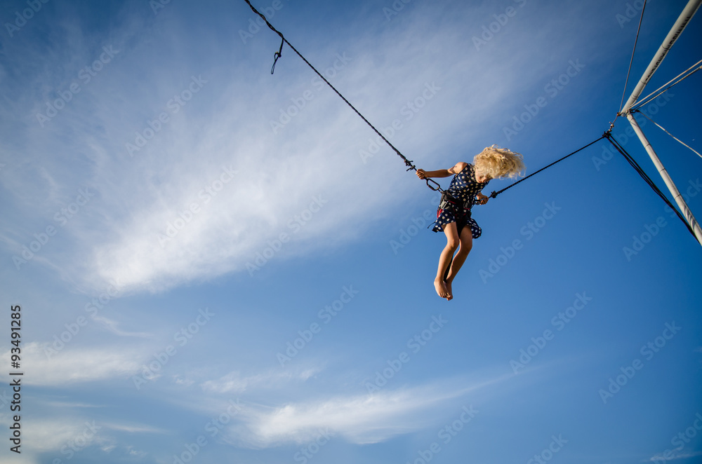 child jumping high into the skies child jumping high into the skies