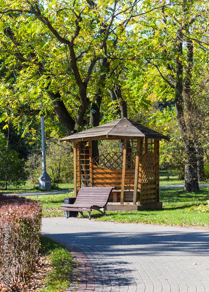 gazebo and a bench under the trees