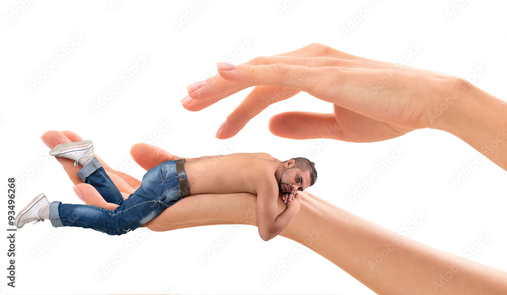 Young man lying on woman's hand