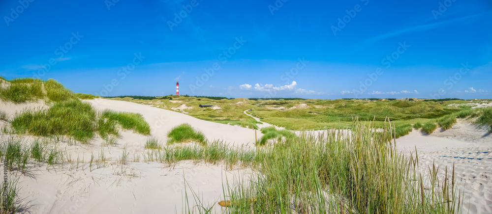 Dune landscape with lighthouse at North Sea