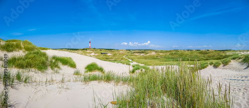 Obraz na płótnie Dune landscape with lighthouse at North Sea w salonie