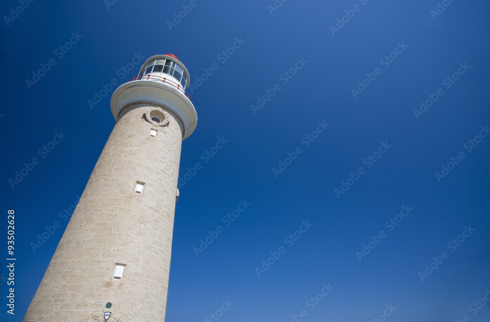 Lighthouse against clear blue sky