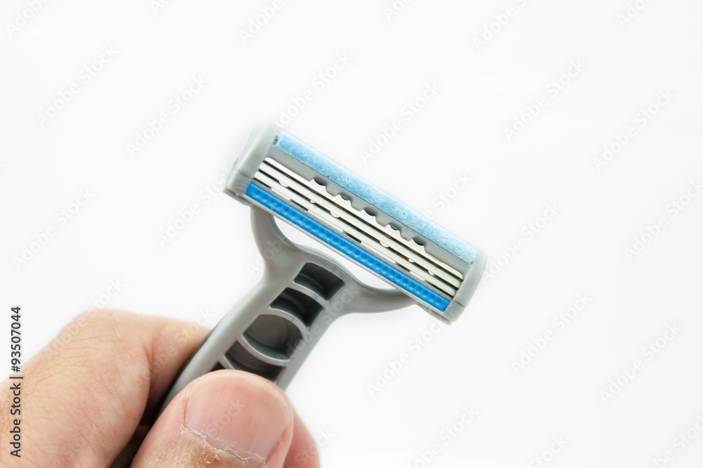 Hand with shaving razor isolated on a white background Hand with shaving razor isolated on a white background