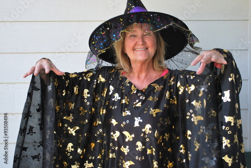 Mature female wearing her halloween costume outside. photo