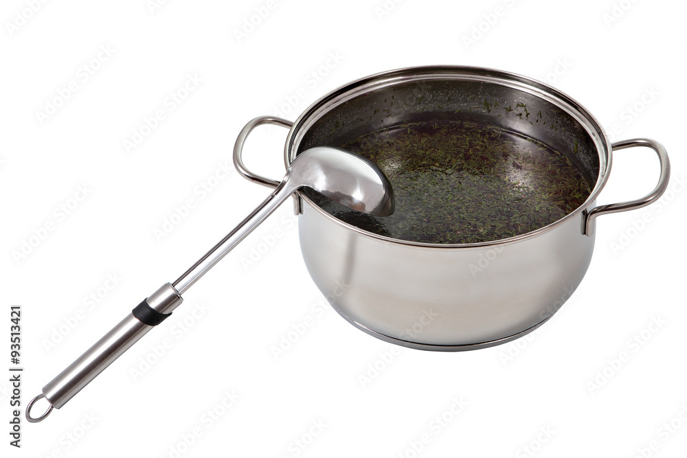 Soup ladle stainless steel lies in a pot of broth. Soup ladle stainless steel lies in a pot of broth.