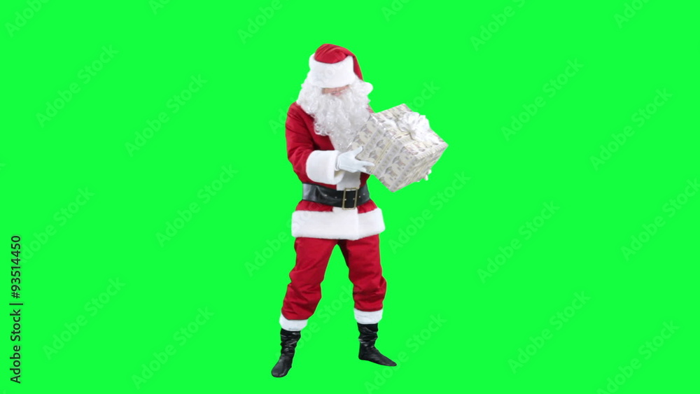 Santa Claus with a gift box chroma key (green screen). Santa examines present isolated on green
Santa Claus with a gift box chroma key (green screen). Santa examines present isolated on green