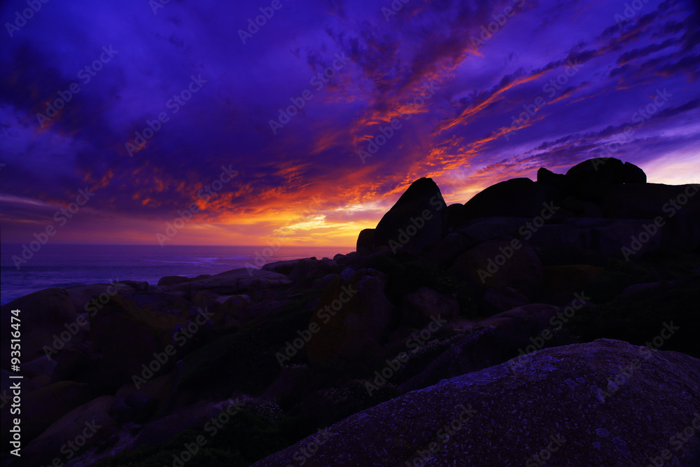 Sunset on rocks / A beautiful sunset on the rocky beach of Llandudno, South Africa