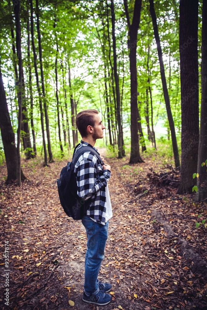 Portrait of young handsome man with backpack wanderer walk Portrait of young handsome man with backpack wanderer walk