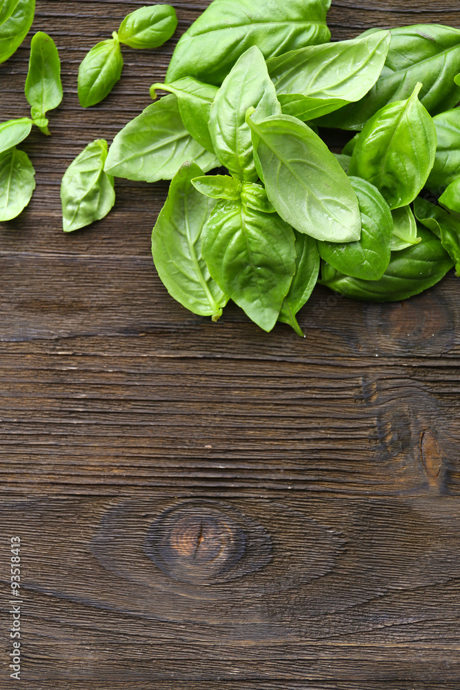 Green fresh basil on wooden background Green fresh basil on wooden background