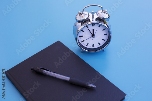 alarm clock with notepad and pen