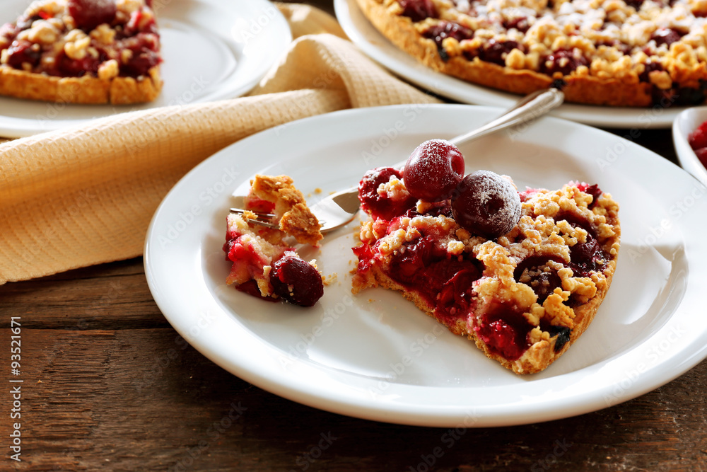 Tasty homemade pie with cherries on table close up Tasty homemade pie with cherries on table close up