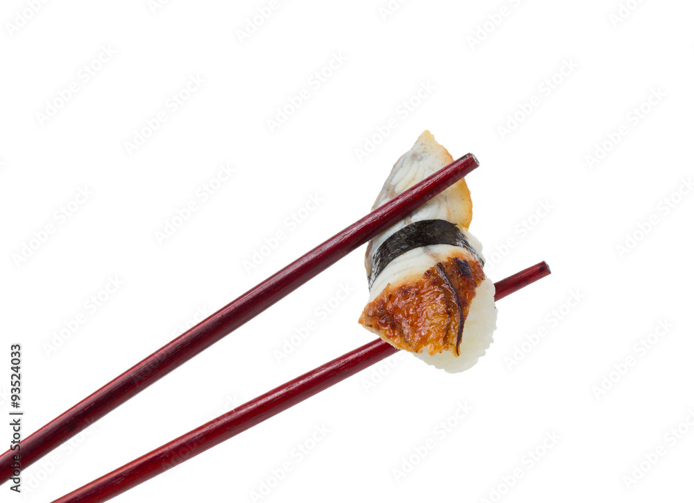 Sushi nigiri in brown chopsticks isolated on white background Sushi nigiri in brown chopsticks isolated on white background