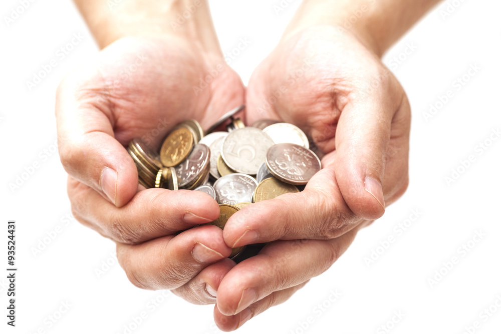 Handful of coins in palm hands isolated on white Handful of coins in palm hands isolated on white