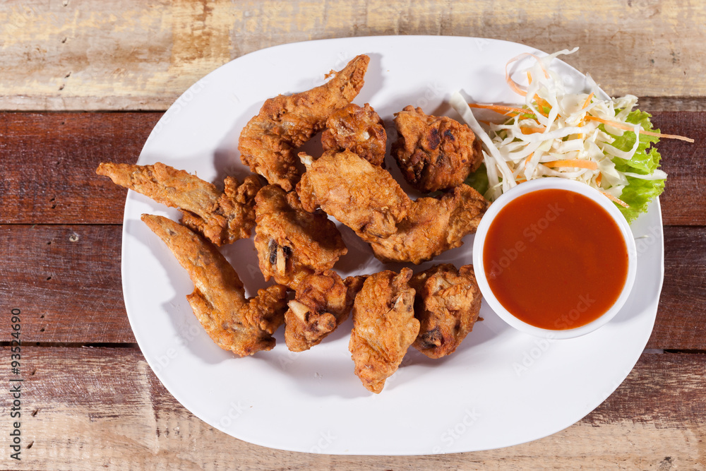 A plate of fresh, hot, crispy fried chicken A plate of fresh, hot, crispy fried chicken