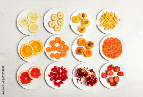 Set of orange products on wooden background