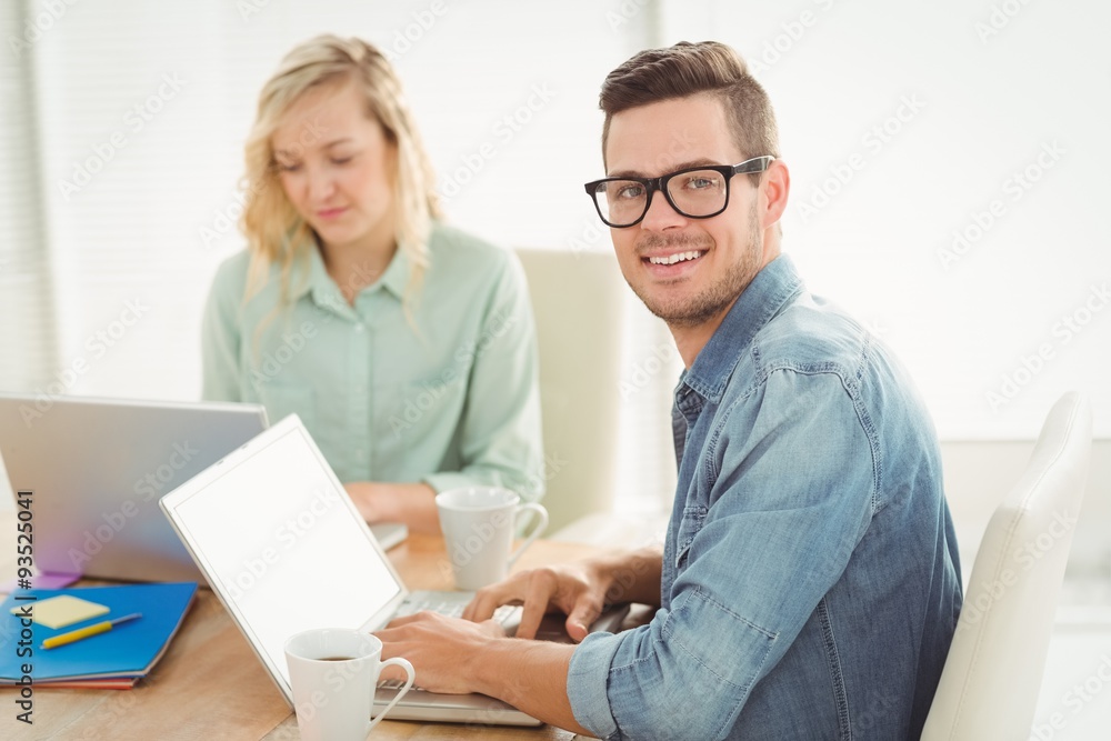 Portrait of smiling young man wearing eyeglasses with woman Portrait of smiling young man wearing eyeglasses with woman